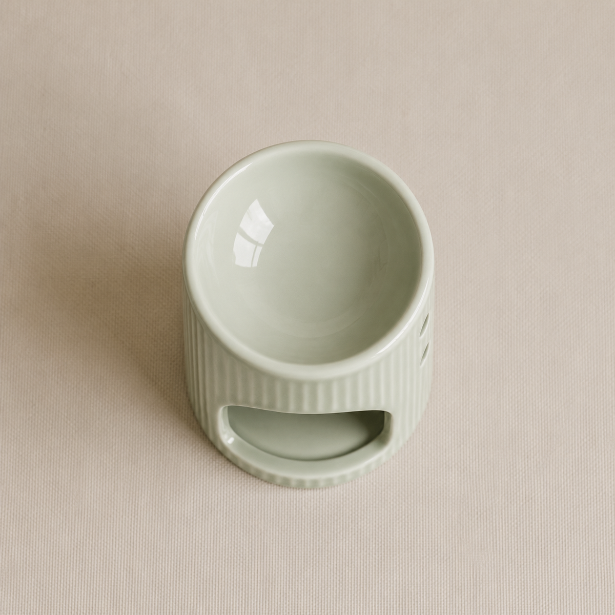 Vista superior de quemador verde para wax melts de cerámica